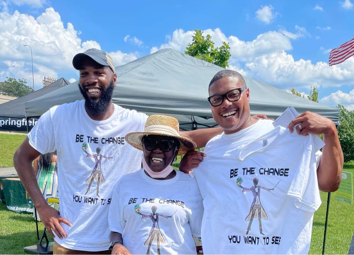 Community members wearing Be the Change shirts at a Chess Angels event